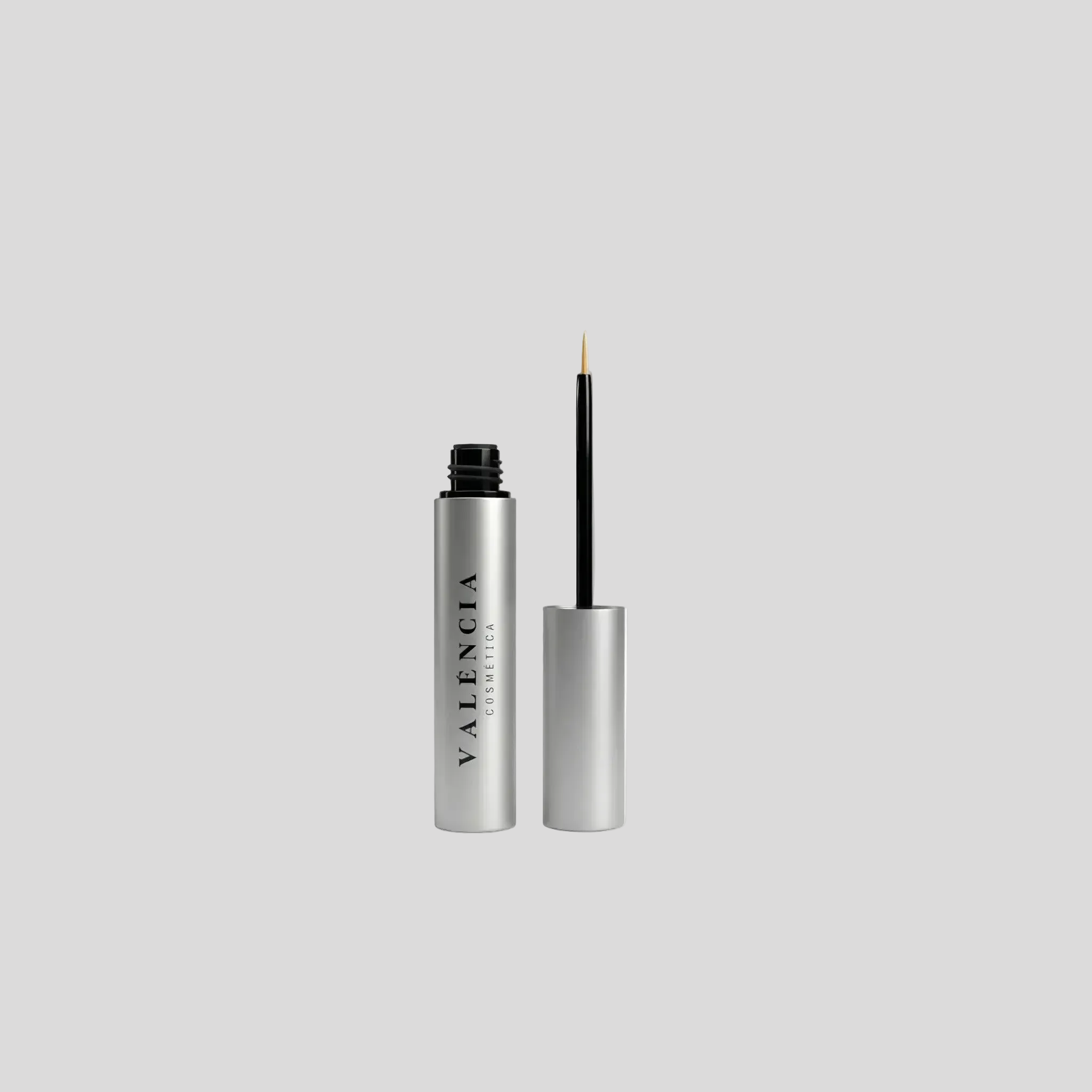 Eyeliner-style applicator with silver tube and black tip, plus cap